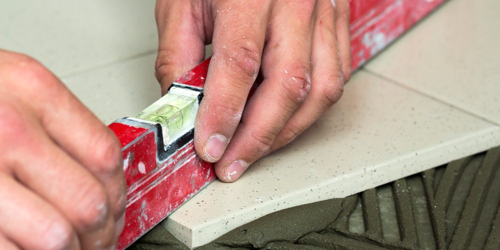 ceramic-tiles-and-tools-for-tiler-worker-hand-inst-RTFMP4X